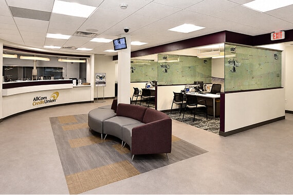 Lobby of AllCom Credit Union with a reception desk and waiting area
